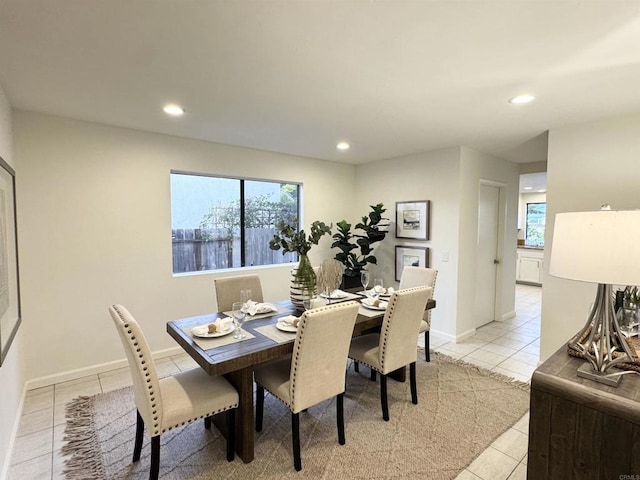 dining area featuring light tile patterned floors, baseboards, plenty of natural light, and recessed lighting