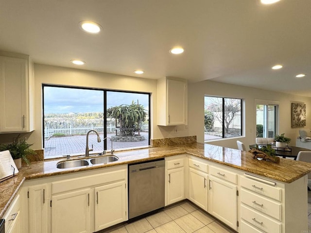 kitchen with dishwasher, recessed lighting, a peninsula, white cabinets, and a sink