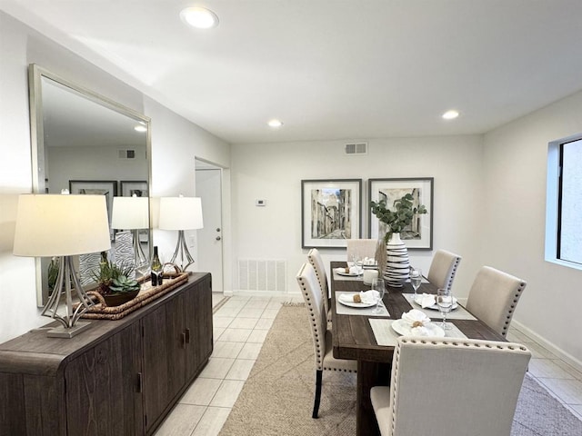 dining room with light tile patterned floors, visible vents, recessed lighting, and baseboards