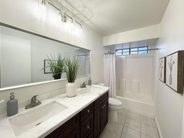 bathroom featuring a sink, toilet, double vanity, and tile patterned flooring