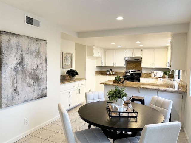 dining area with light tile patterned floors, visible vents, baseboards, and recessed lighting