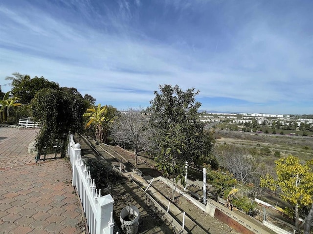 exterior space featuring central AC unit and fence