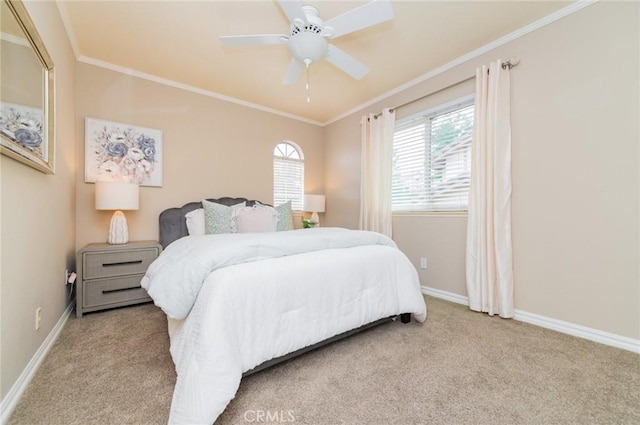 bedroom featuring carpet flooring, a ceiling fan, baseboards, and ornamental molding