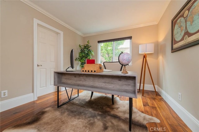 home office with baseboards, wood finished floors, and crown molding