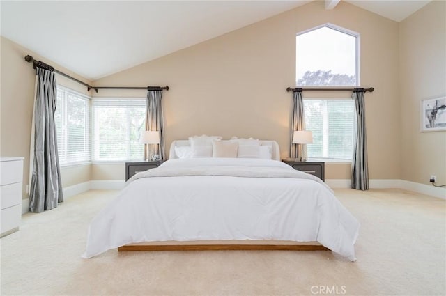 bedroom featuring carpet flooring, beamed ceiling, and baseboards