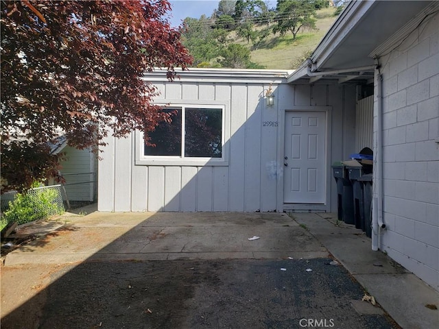 12998 Lakeshore Dr, Clearlake, CA 95422 - property entrance with concrete block siding, fence, and a patio area