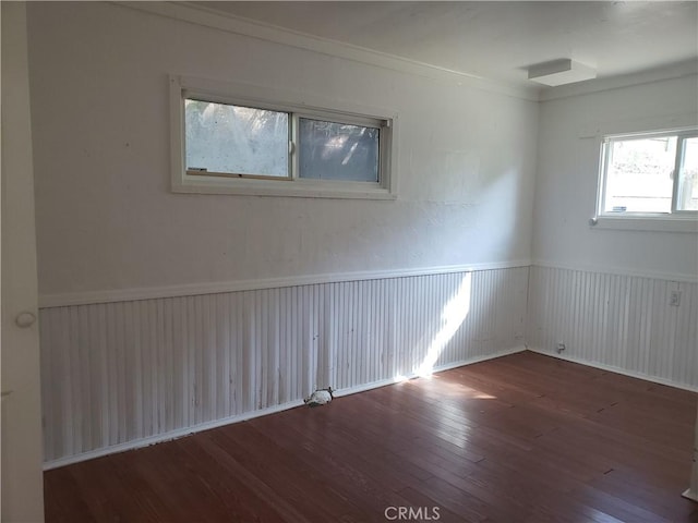 12998 Lakeshore Dr, Clearlake, CA 95422 - spare room with a wainscoted wall and wood finished floors
