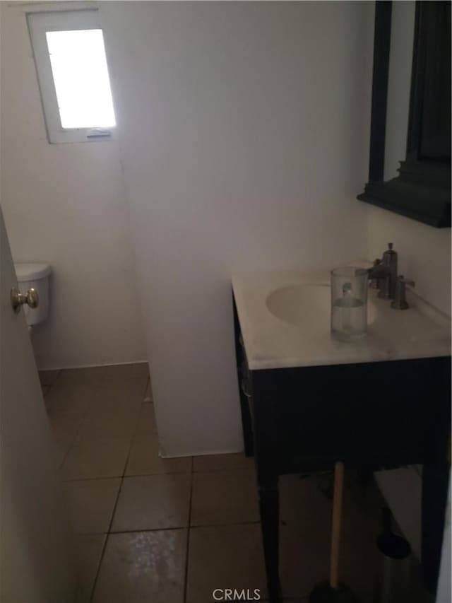 12998 Lakeshore Dr, Clearlake, CA 95422 - bathroom featuring tile patterned floors, toilet, and vanity
