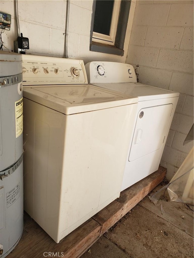 12998 Lakeshore Dr, Clearlake, CA 95422 - laundry area with laundry area, strapped water heater, concrete block wall, and separate washer and dryer