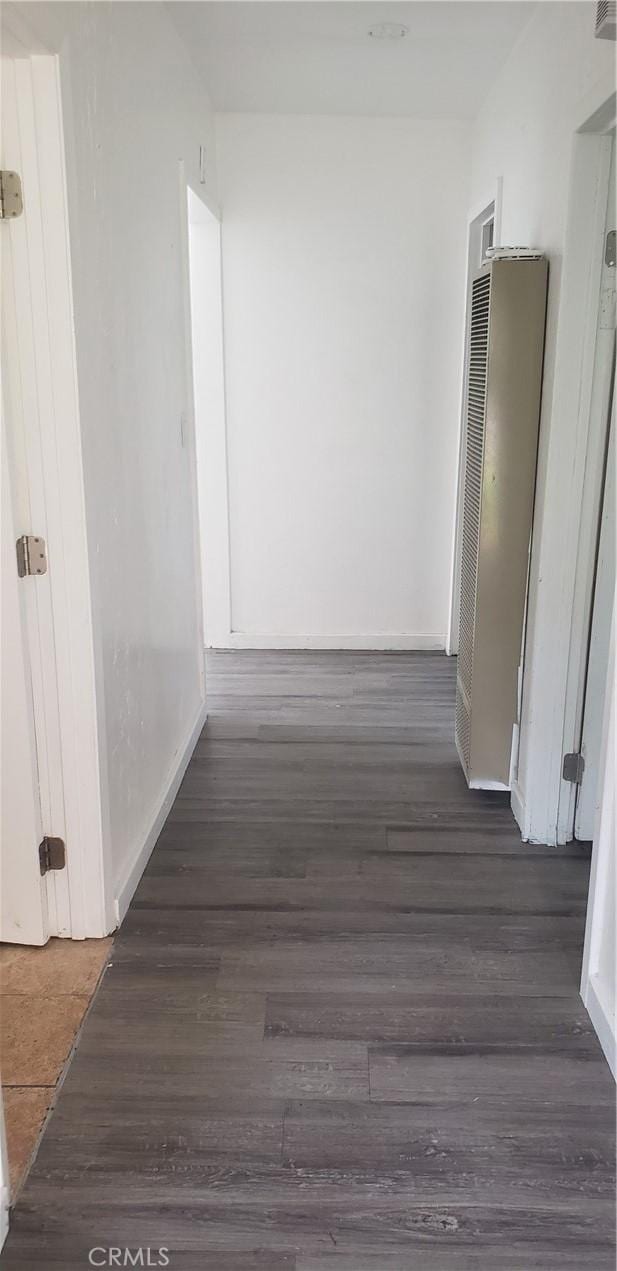 12998 Lakeshore Dr, Clearlake, CA 95422 - hallway featuring dark wood-style floors and baseboards