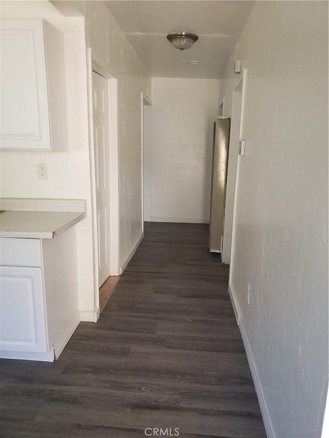 12998 Lakeshore Dr, Clearlake, CA 95422 - corridor featuring baseboards and dark wood-type flooring
