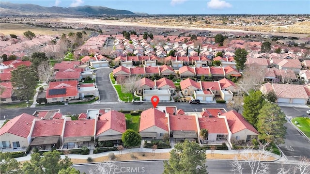 birds eye view of property featuring a mountain view and a residential view