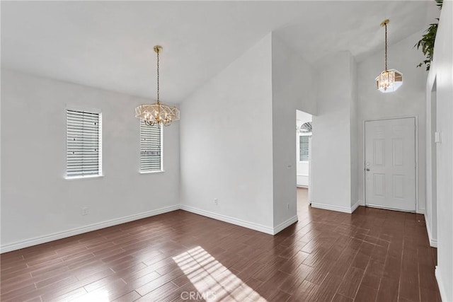 unfurnished dining area with dark wood-style floors, baseboards, and a chandelier