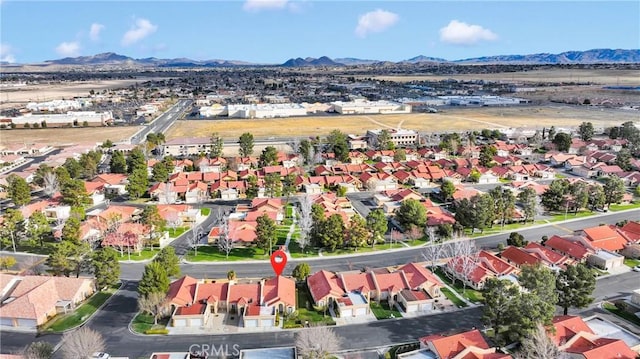 drone / aerial view with a mountain view and a residential view