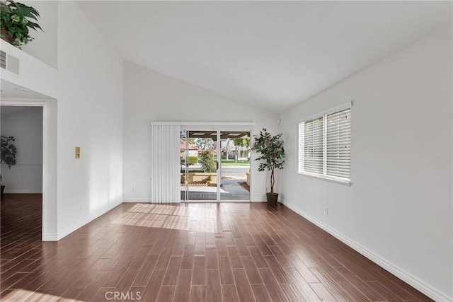 unfurnished room featuring visible vents, baseboards, and wood finished floors