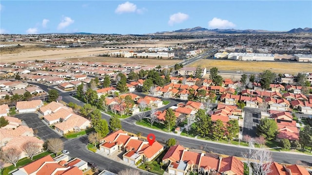 drone / aerial view with a mountain view and a residential view