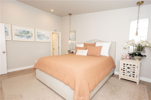 bedroom featuring visible vents, recessed lighting, baseboards, and wood finished floors