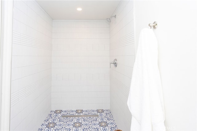 bathroom with tiled shower