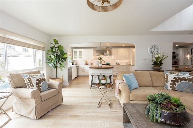 living area with recessed lighting and light wood-type flooring