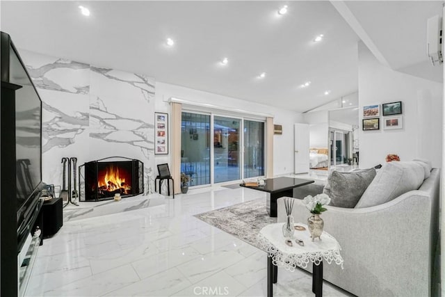 living area featuring recessed lighting, marble finish floor, lofted ceiling, and a premium fireplace