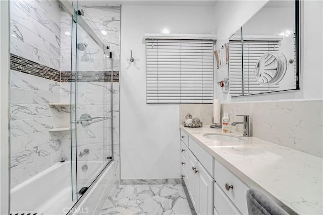 bathroom with vanity, combined bath / shower with glass door, and marble finish floor