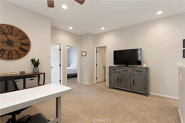 office space featuring recessed lighting, light colored carpet, baseboards, and ceiling fan