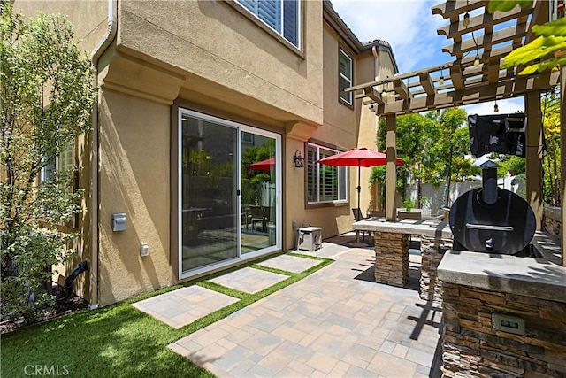 view of patio / terrace featuring a pergola and fence