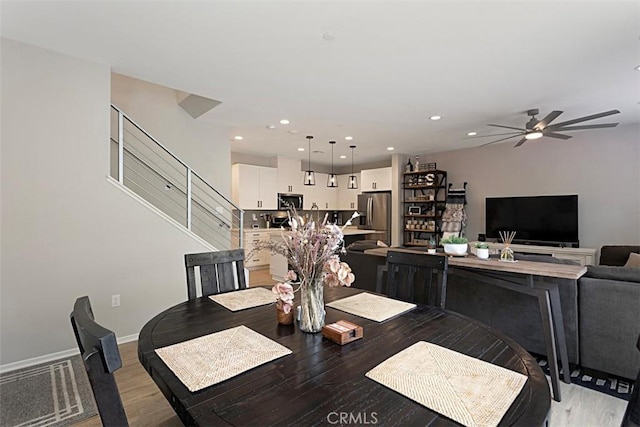 dining area with baseboards, recessed lighting, light wood-type flooring, and ceiling fan