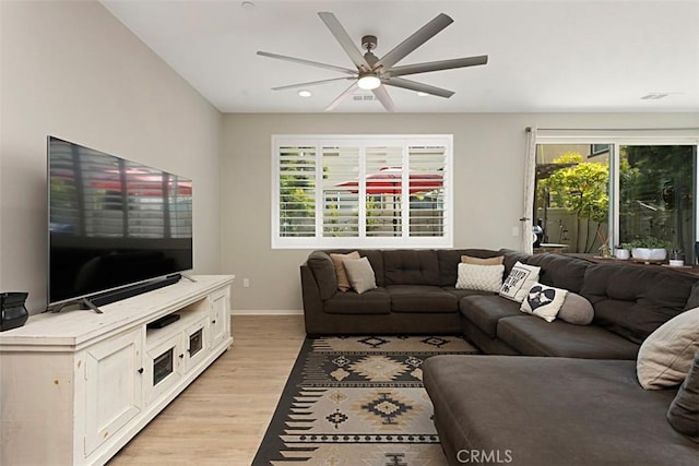 living room featuring recessed lighting, light wood-style flooring, baseboards, and a ceiling fan