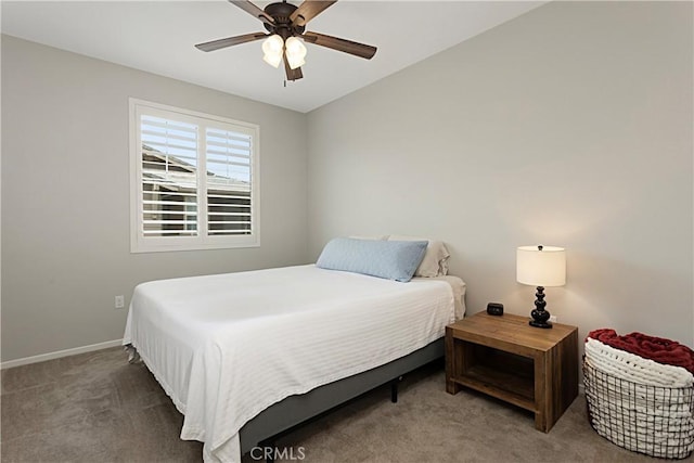 carpeted bedroom featuring a ceiling fan and baseboards