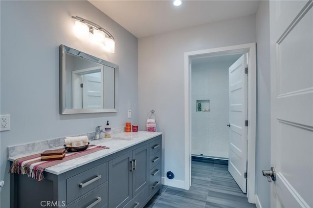 bathroom featuring vanity and baseboards