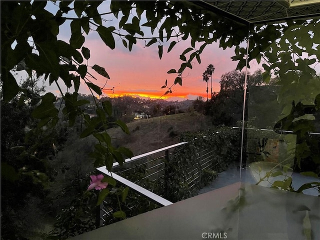 view of balcony at dusk