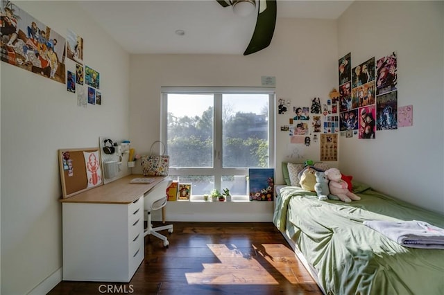 bedroom featuring wood finished floors and a ceiling fan