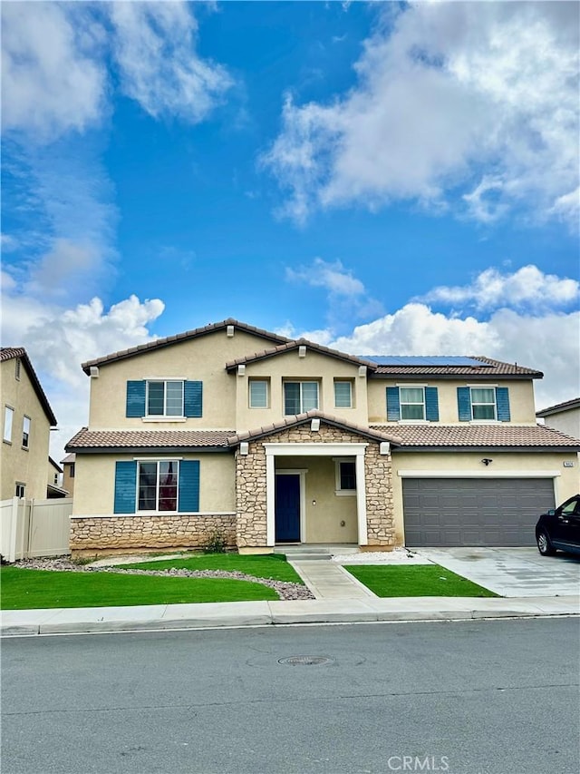 36626 Sevilla Way, Beaumont, CA 92223 - view of front facade with stone siding, stucco siding, driveway, a tiled roof, and a garage