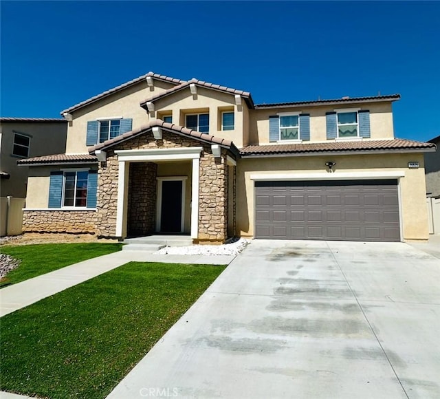 36626 Sevilla Way, Beaumont, CA 92223 - view of front of property with stone siding, stucco siding, an attached garage, and driveway
