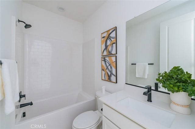 bathroom featuring vanity, shower / bathing tub combination, and toilet