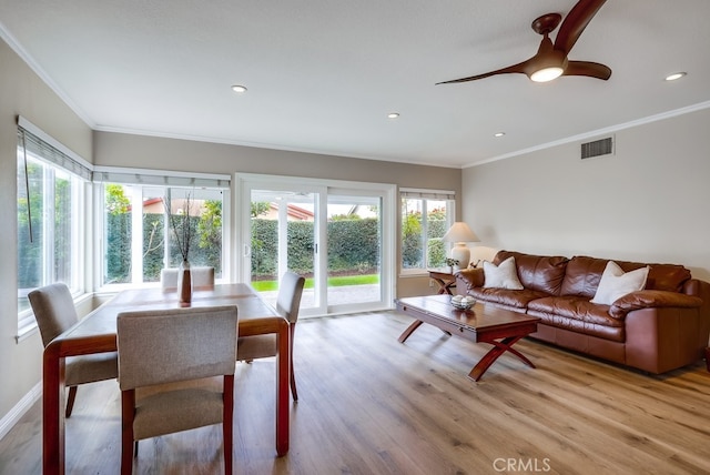 living room featuring visible vents, ornamental molding, wood finished floors, recessed lighting, and baseboards