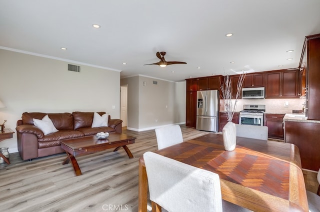 dining space with recessed lighting, visible vents, baseboards, and light wood finished floors