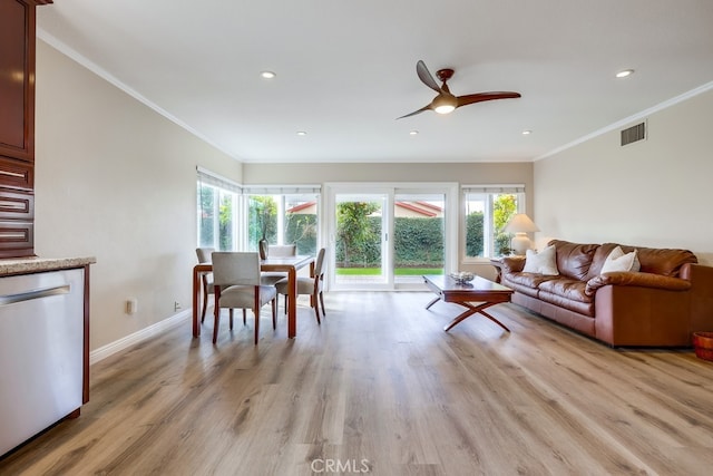 living room featuring visible vents, light wood-style floors, ceiling fan, and crown molding