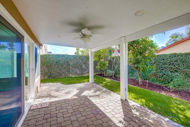 view of patio featuring ceiling fan