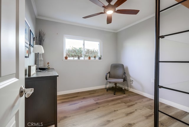 office area featuring light wood finished floors, baseboards, crown molding, and a ceiling fan