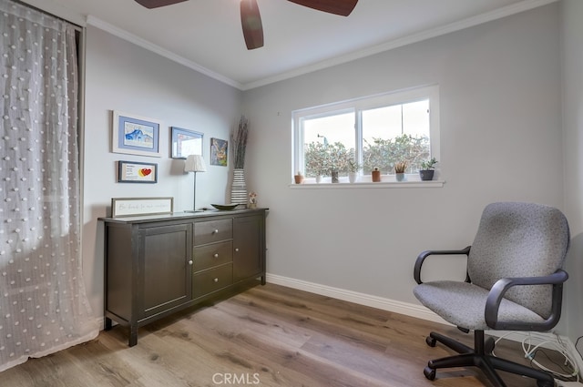 sitting room featuring baseboards, wood finished floors, ornamental molding, and a ceiling fan