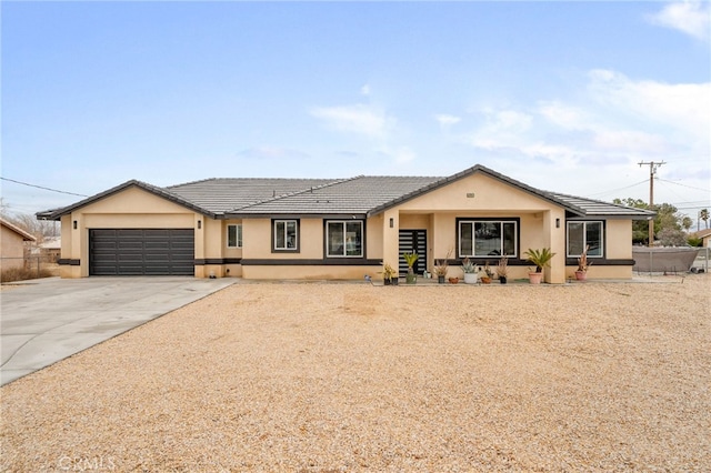 10983 Redwood Ave, Hesperia, CA 92345 - ranch-style home featuring driveway, an attached garage, and stucco siding