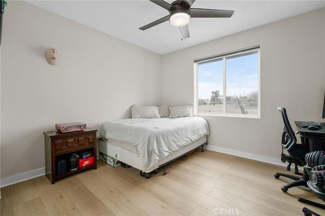 10983 Redwood Ave, Hesperia, CA 92345 - bedroom with light wood-style floors, baseboards, an office area, and ceiling fan