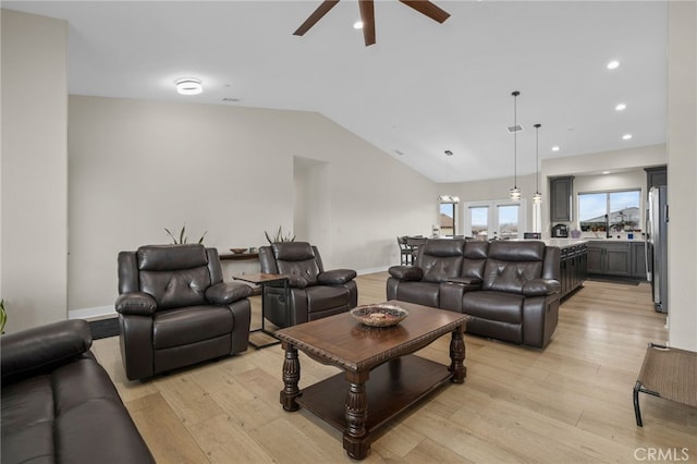 10983 Redwood Ave, Hesperia, CA 92345 - living area with ceiling fan, light wood-style flooring, vaulted ceiling, baseboards, and recessed lighting