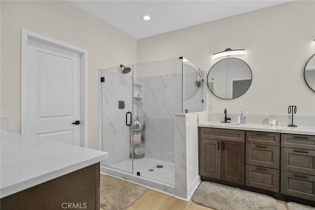 10983 Redwood Ave, Hesperia, CA 92345 - full bath featuring a marble finish shower, wood finished floors, vanity, and recessed lighting