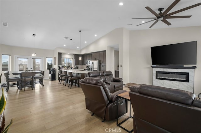 10983 Redwood Ave, Hesperia, CA 92345 - living room featuring a ceiling fan, a glass covered fireplace, plenty of natural light, light wood finished floors, and recessed lighting