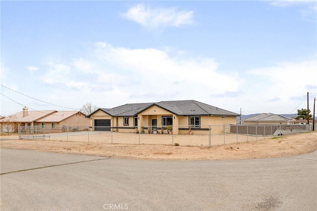 10983 Redwood Ave, Hesperia, CA 92345 - view of front facade with a garage, concrete driveway, and stucco siding