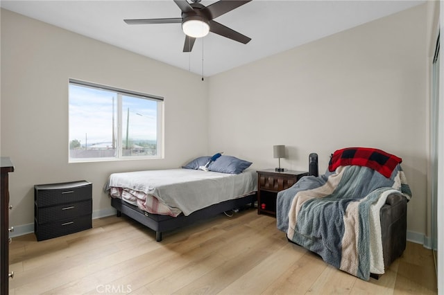 10983 Redwood Ave, Hesperia, CA 92345 - bedroom featuring light wood-style floors, baseboards, and ceiling fan