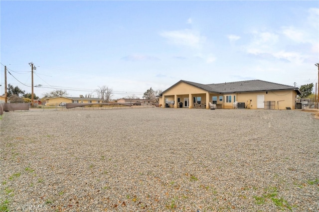 10983 Redwood Ave, Hesperia, CA 92345 - view of front of home with stucco siding and fence